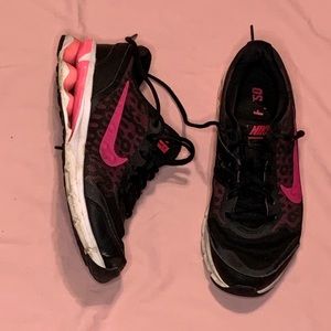 Nike black and hot pink athletic shoes